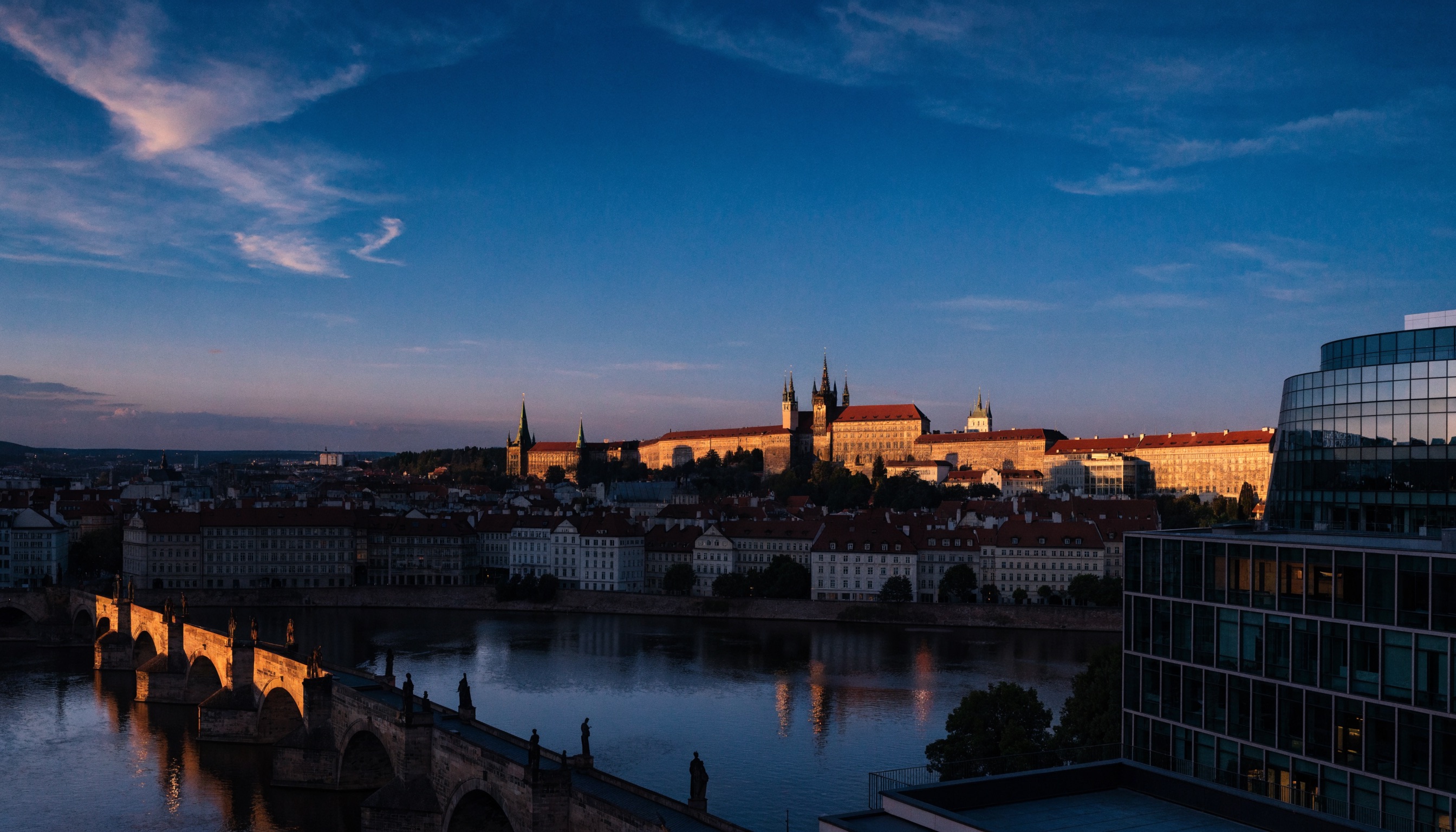 Prague skyline at dusk with modern office buildings